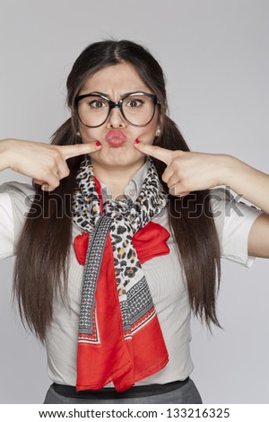 Young nerd woman funny expression on white background