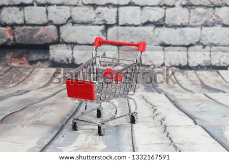 Shopping trolley with bricks wall