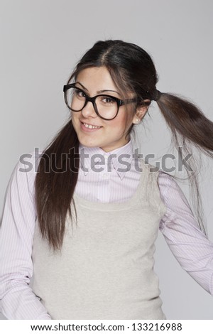 Young nerd woman funny expression posing on white background
