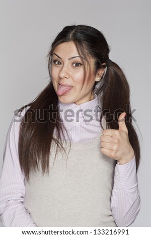 Young nerd woman funny expression posing on white background