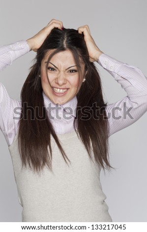 Young desperate nerd woman crazy expression posing on white background
