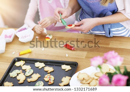 Picture of mother and daughter preparing cookies in the kitchen