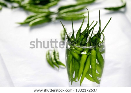 Chilli in the glass Royalty-Free Stock Photo #1332172637