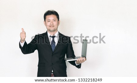 Young businessman smile and making the ok gesture