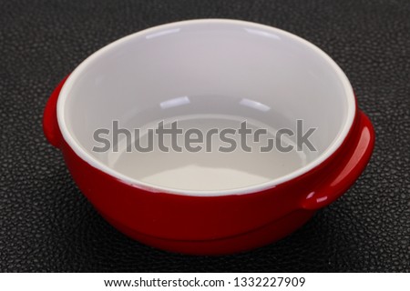 Empty ceramic bowl over black background