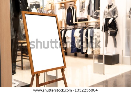 Blank promotion poster display stand at clothes shop or storefront.Promotion information for announcement message successful marketing.