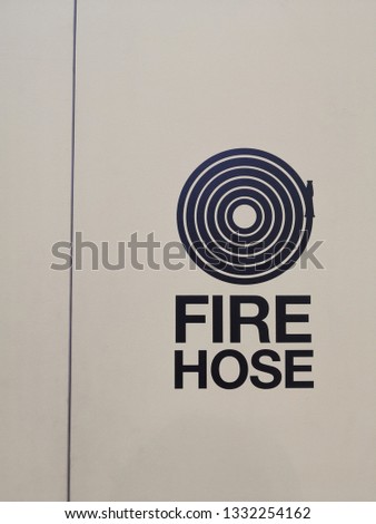 Firehose Sign strick on the cabinet wood. 