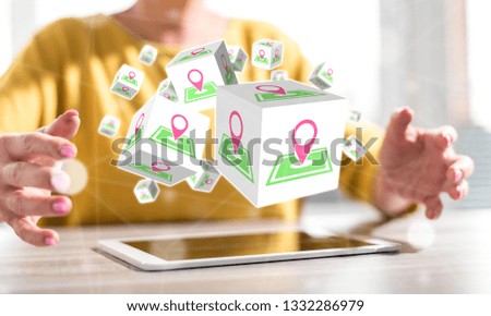Digital tablet with gps concept between hands of a woman in background