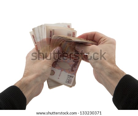 man's hands recalculates cash in Russian rubles on white