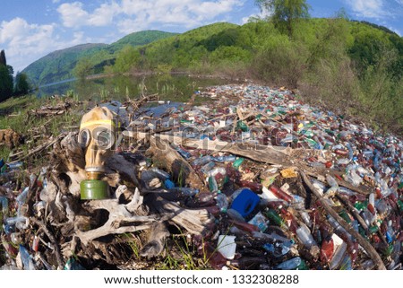 Pollution of household waste of clean mountain rivers in the Carpathians Ukraine is a huge problem for people. Special workers collect garbage, as a symbol of saving the planet Earth
