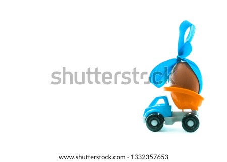 Easter egg and toy car on white background, happy easter day concept, space for text