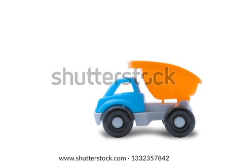 Toy truck on a white background, close-up, concept of building work or child's play