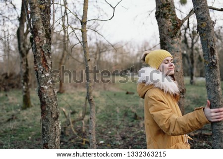   woman in a jacket in nature                             