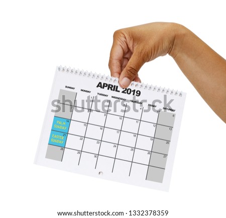 Easter and Palm Sunday April 2019 Calendar held in hand white background