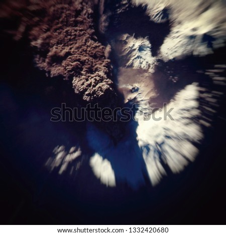 Eruption of the volcano. Shot from space. Elements of this image furnished by NASA.