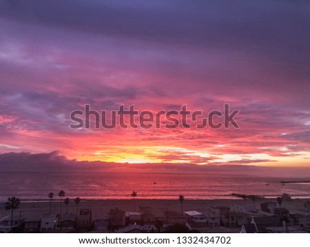 Bright colorful sunset over the pacific ocean in Playa del Rey, CA