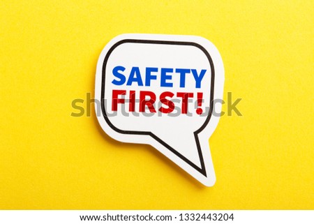 Safety first concept speech bubble isolated on yellow background.