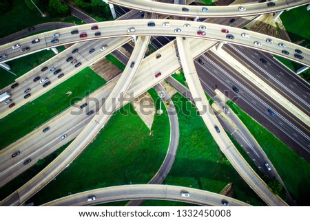 Straight down aerial drone view looking down from above Interchange highway overpass roads loops mopac expressway in Austin Texas USA green Texas hill country landscape urban connection