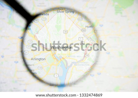 Washington city visualization illustrative concept on display screen through magnifying glass