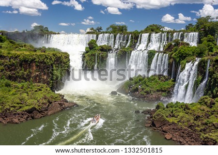 Amazing view of Iguazu Falls, one of the new seven wonders of the world, on the border with Brazil and Argentina. Royalty-Free Stock Photo #1332501815