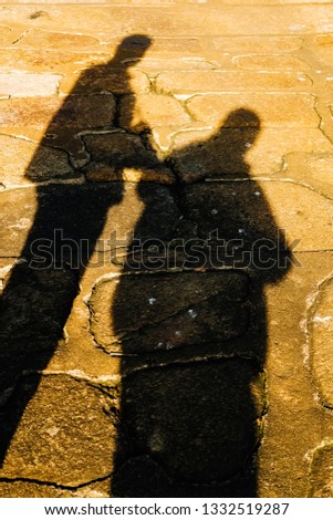 Silhoutte of Two People - One Skinny and One Fat