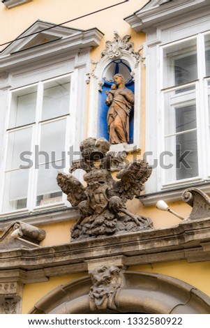 Imperial eagle emblem on building in historic center.