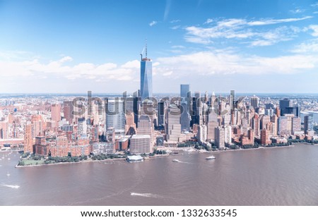 Amazing aerial view of New York City. Downtown Manhattan skyline from helicopter on a sunny afternoon.