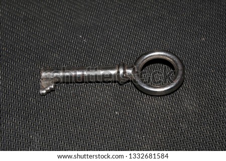 door key isolated on black background