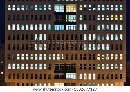 Modern office building at night close up