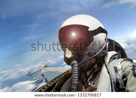 Fighter pilot cockpit view at sunrise Royalty-Free Stock Photo #1332700817