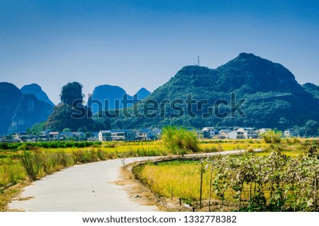 Country road with mountain background scenery in fall