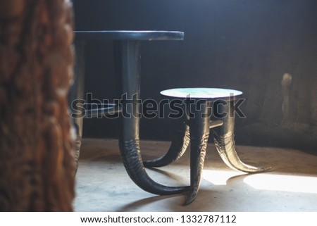 The horn furniture, set of black horn table and chair in the room with sunlight from the window. 