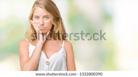 Beautiful young woman over isolated background thinking looking tired and bored with depression problems with crossed arms.