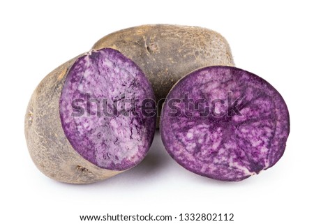 purple potato isolated on white background. place for text. the potatoes are cut. clearly visible texture of potatoes in the cut
