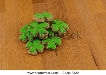 clover saint patrick's day a bunch of gingerbread mastic on a wooden surface