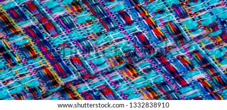 Background texture, pattern. Winter fabric, warm. big braided thread. Blue-red yellow threads. This photo will make your design the best. Wallpapers, pictures, posters.