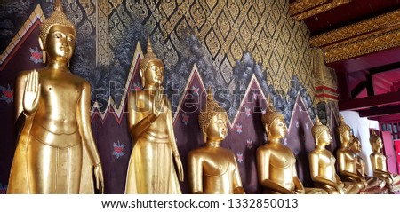 Many golden Buddha statue standing and sitting at Wat Phra Sri Rattana Mahatat Woramahawihan or Wat Yai temple in Phitsanulok, Thailand. Religion, Buddhist, Landmark and Ancient art concept.  