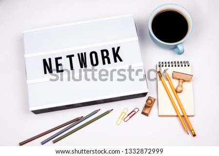 Network. Text in lightbox. White desk with stationery