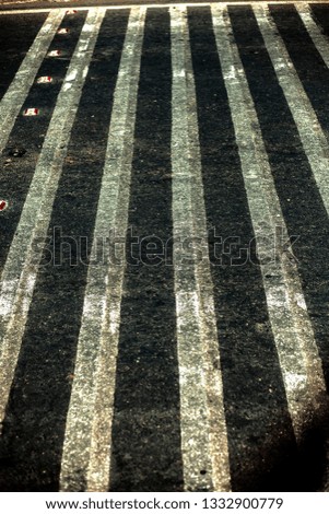 Extreme close up shot of cross walks or zebra crossing on roads.