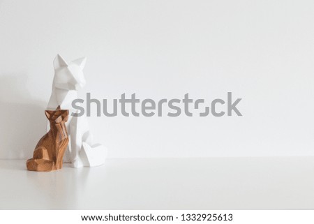 Decorative origami sculpture and white wall mock up 