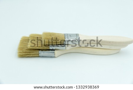 three painter brushes on white background ideal for product photography