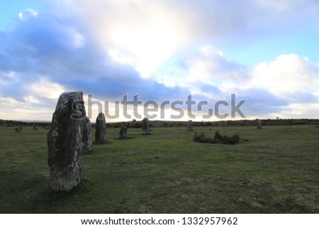 Standing stones left in the shadow of the blue hour as the sun sinks below the horizon. The image depicts the cold exposed remoteness of the landscape at dusk and the coldness of the coming night.