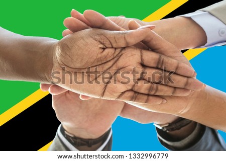 Tanzania flag, intergration of a multicultural group of young people