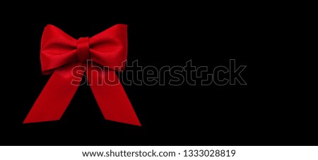 Red Ribbon Present Decoration Isolated on Black Background
