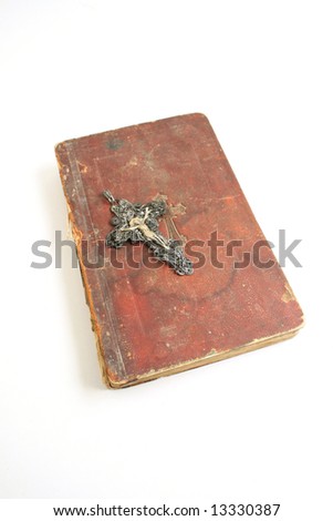 old bible and cross religious concepts on white vertical