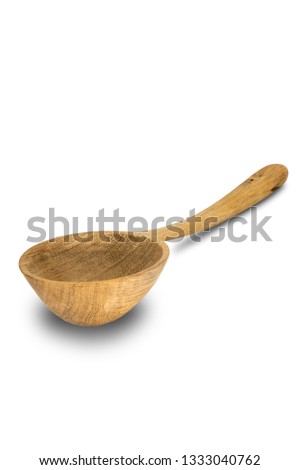 Isolate of a big (ladle) wooden spoon of oak. Closeup. Nice texture.