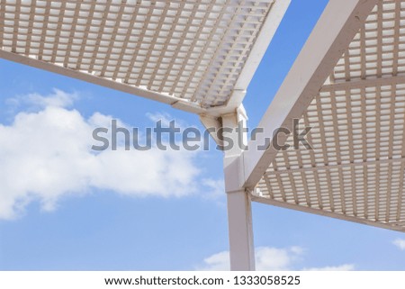 white metal construction on blue sky background vivid colorful summer environment geometry shape concept photography