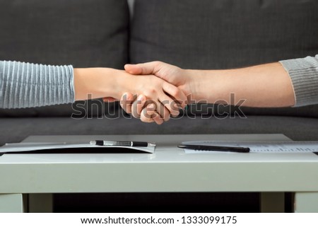 Man and woman shake hands close-up. Family quarrel, showdown, property division, divorce agreement