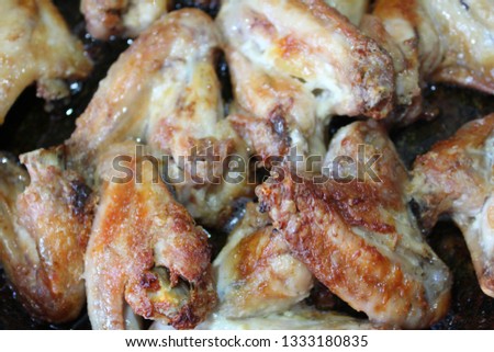  photo of chicken wings fried. many pieces of meat appetizing. healthy and tasty food.