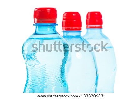 row of tops of bottles